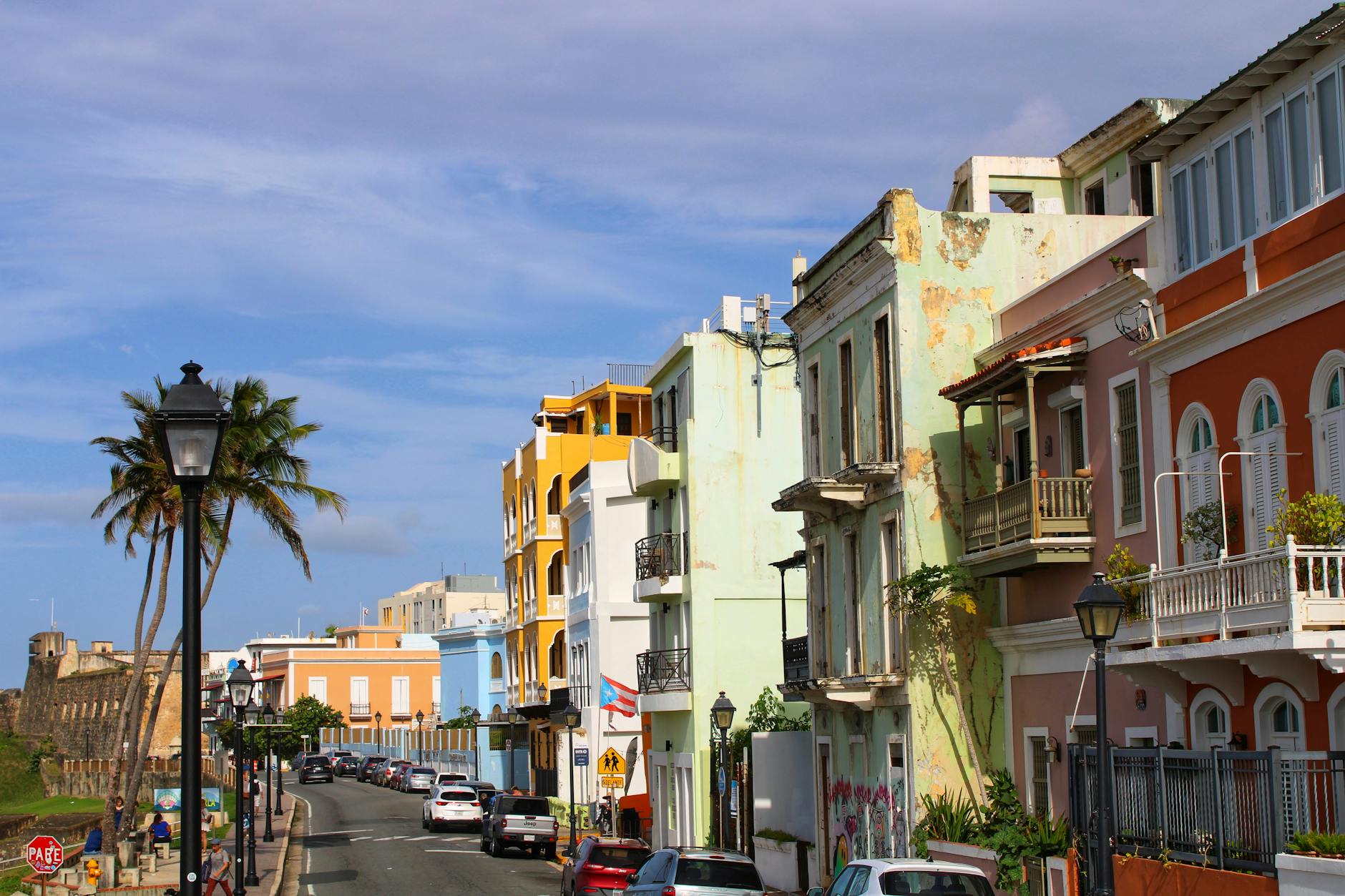 Vibrant colonial buildings lining sunny historic street in Old San Juan Puerto Rico